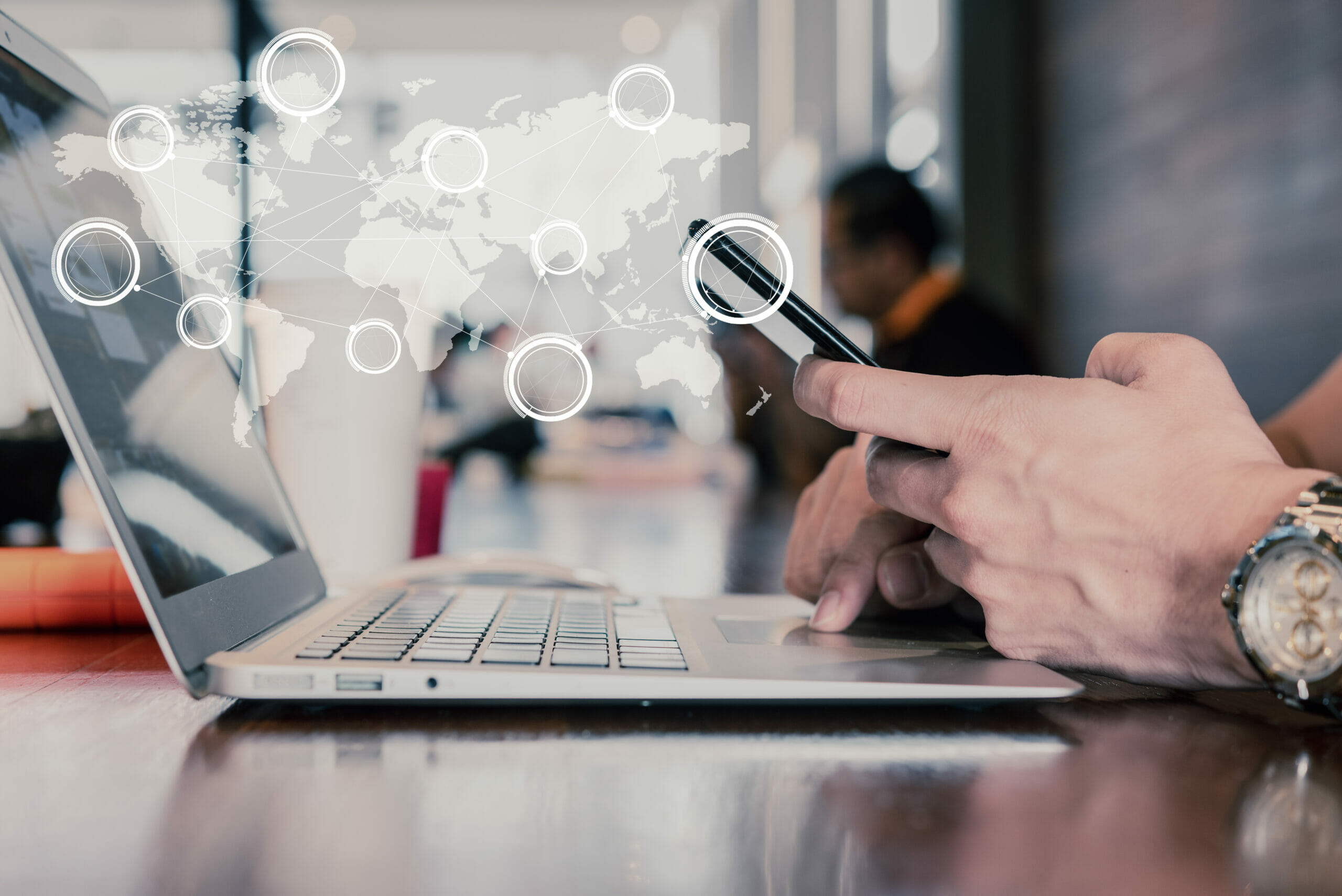 Hand of man use smartphone and laptop with technology of globalization connectivity conceptual