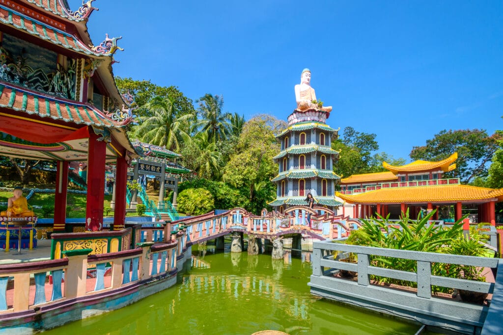 Chinese Pagoda and Pavilion by the Lake at Haw Par Villa Theme Park. This park has statues and dioramas scenes from Chinese mythology, folklore, legends, and history.