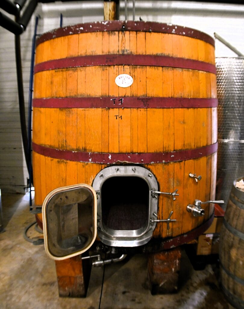 Large wooden wine vat atMas Olivier Winery