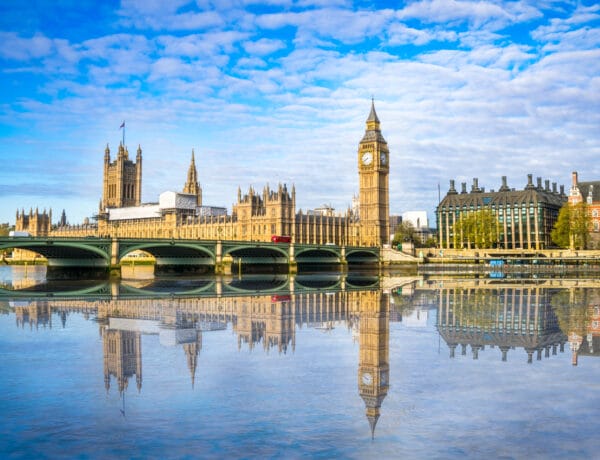 Big Ben and Westminster parliament with blurry refletion in London, United Kingdom at sunny day. Image from Adobe Stock License Purchased