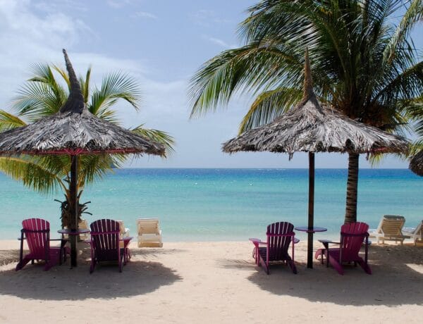 caribbean beach with umbrellas and beach chairs