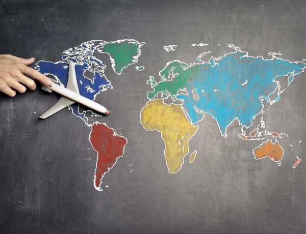 World map with a plane leaving USA