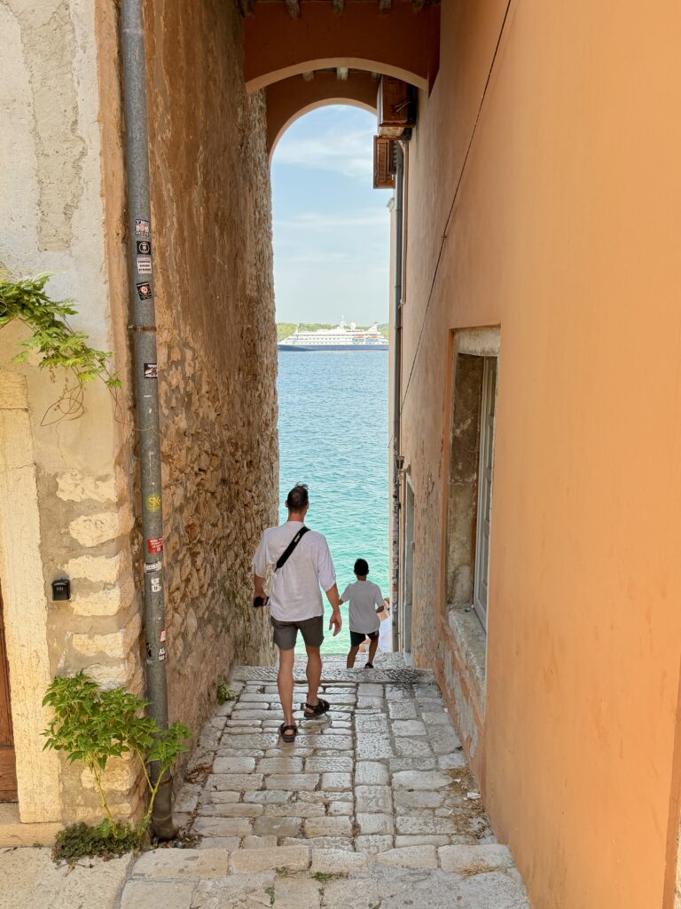 Rovinj street scene ending at the water